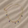 Náhrdelník v zlatej farbe so zafírovo modrou kvapkou